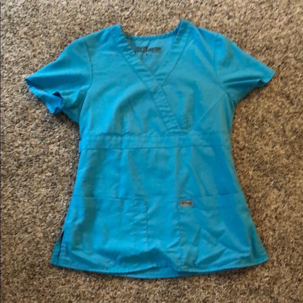 Used Grey’s anatomy scrub top.  Blue.